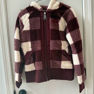 The North Face Maroon & white fleece zip up.